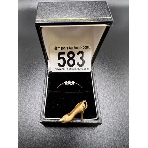 583 - 9ct gold ring with 3 stone diamond. Size N + 9ct gold shoe charm. 2.3g gross