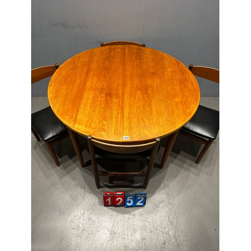 1252 - Mid century teak round table & 4 curve back vinyl chairs