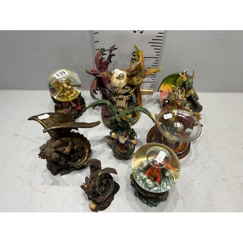 139 - 2 Dragon glitter globes + quantity dragon figures