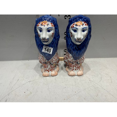 140 - Pair Of Staffordshire lion figures