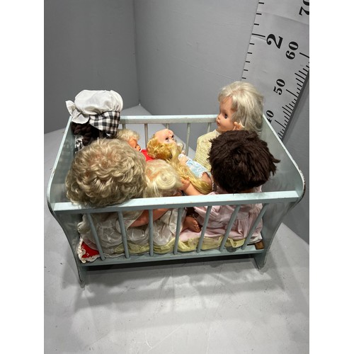 153 - Dolls rocking cradle with dolls