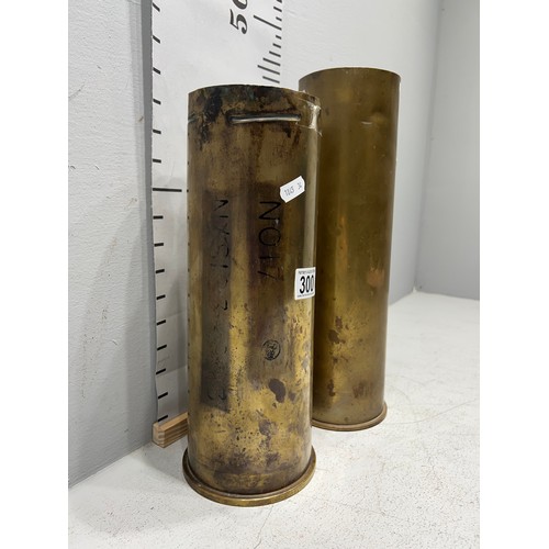 300 - 2 early Brass shell stick stands