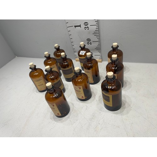 321 - 12 Brown chemist bottles with corks