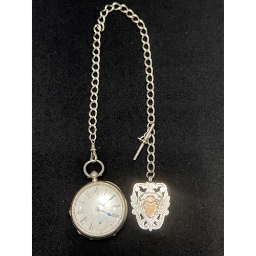 643 - Silver pocket watch & chain with silver medal