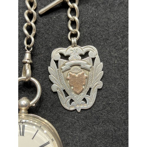 643 - Silver pocket watch & chain with silver medal