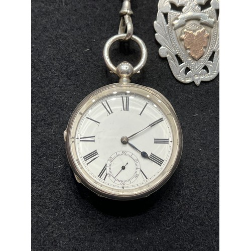 643 - Silver pocket watch & chain with silver medal