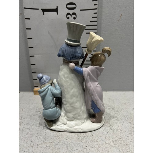 676 - Lladro 5713 group figure girl, boy, dog & snowman