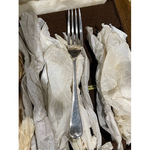 4 - 1920's oak cased canteen cutlery still wrapped in original wrapping