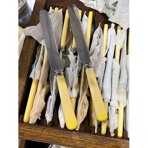 4 - 1920's oak cased canteen cutlery still wrapped in original wrapping