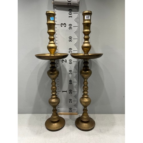 68 - Pair of tall heavy brass candle stand