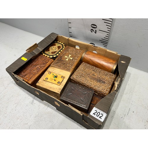 202 - Box of treen ware inc carved etc