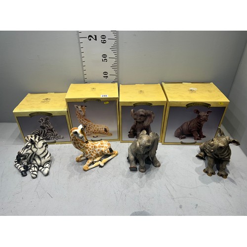 245 - 4 Boxed animals, zebra, giraffe, elephant, rhino