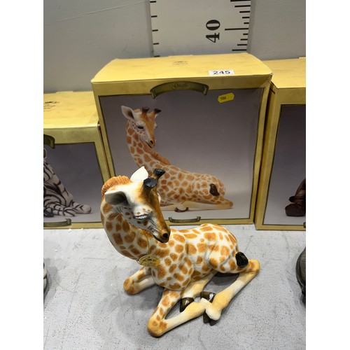 245 - 4 Boxed animals, zebra, giraffe, elephant, rhino