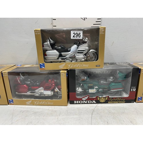 296 - 5 boxed Honda gold wing motorbikes