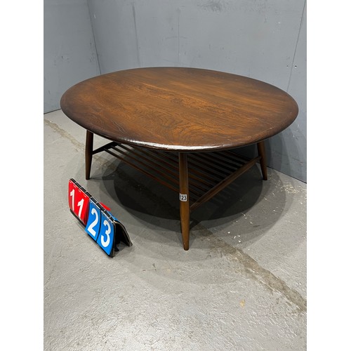 1123 - Circular mid century ercol coffee table with magazine rack