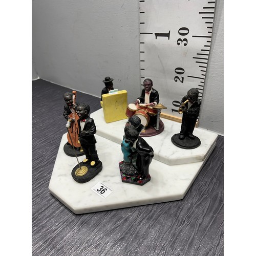 36 - Marble stand with music group figures