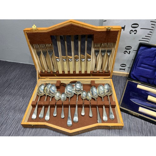109 - Walnut cased cutlery set + boxed 4 piece carving set
