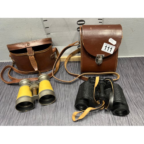 111 - 2 pair cased binoculars in leather cases