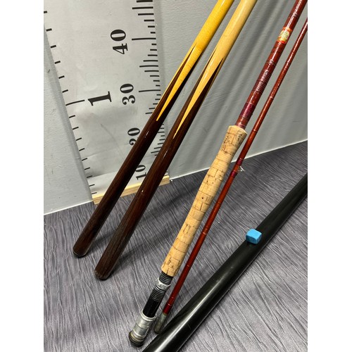 116 - 2 snooker cues. One in metal case, one in soft case + cane fishing rod by Bernard Sealey + Co. ???