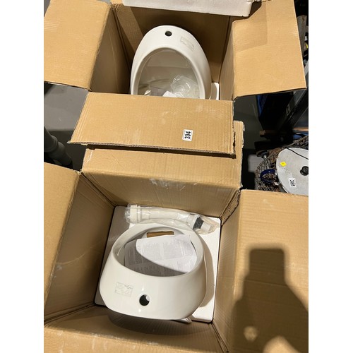 394 - 2 Brand new urinals boxed cost £150 each new