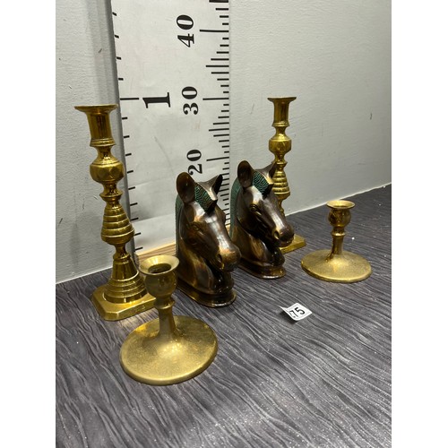 275 - 2 Pairs brass candlesticks + 2 brass horse bookends