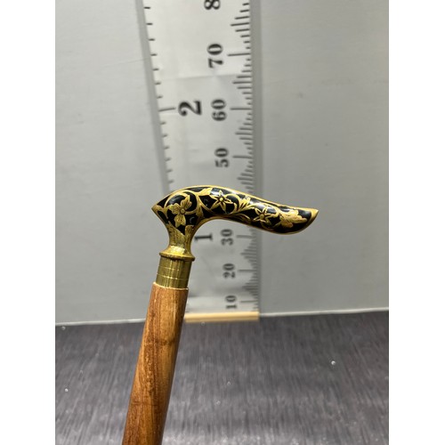 278 - Brass inlaid walking stick