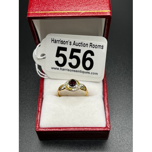 556 - Gold on silver dress ring with red stone Size P