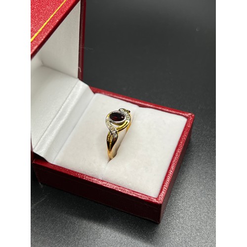 556 - Gold on silver dress ring with red stone Size P