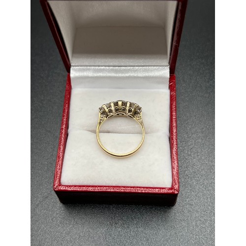 559 - 9ct gold 3 stone dress ring size L 2.4g gross