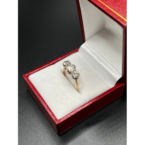 559 - 9ct gold 3 stone dress ring size L 2.4g gross