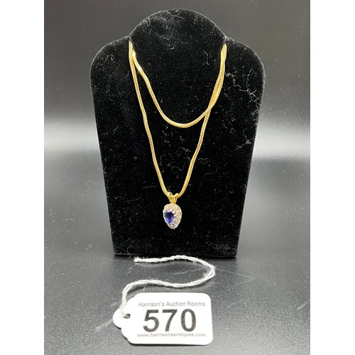 570 - 18ct gold pear shaped tanzanite & Diamond pendant & 18ct gold chain 12.5g gross chain 23