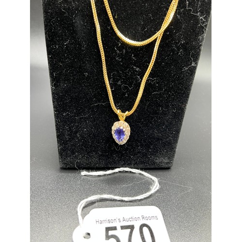 570 - 18ct gold pear shaped tanzanite & Diamond pendant & 18ct gold chain 12.5g gross chain 23