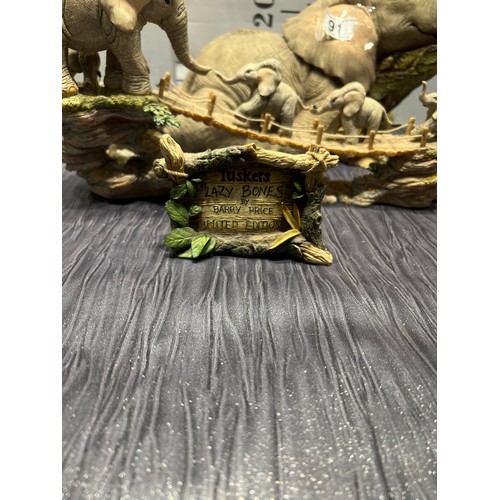 91 - 2 Tuskers ltd edition elephants with tuskers lazy bones sign 2,073/2,500