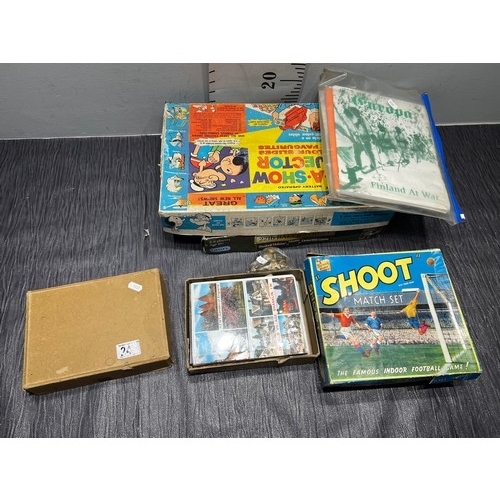 242 - Vintage postcards military buttons, vintage boxed games