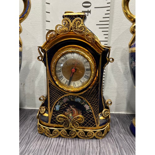 299 - 3 Piece blue garniture set clock & 2 vases