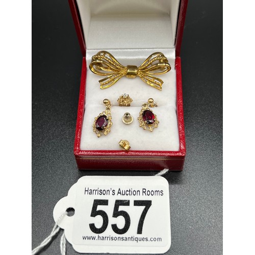 557 - 9ct Gold brooch + pair 9ct gold garnet earrings + 1 other 9ct earring 5.5g gross