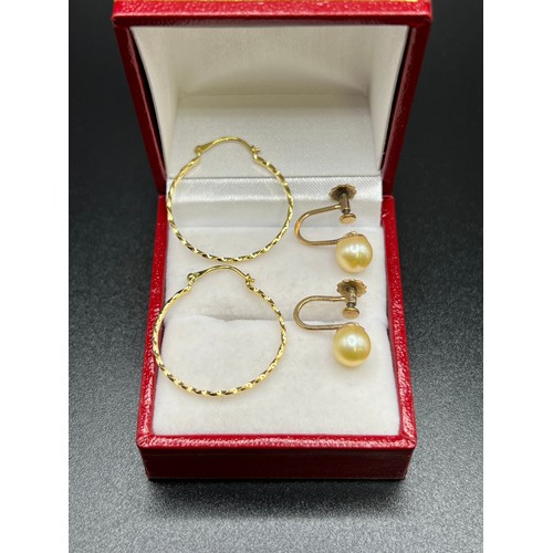 556 - 1 Pair 9ct gold pearl earrings + 1 pair 9ct gold hoop earrings 2.9g gross