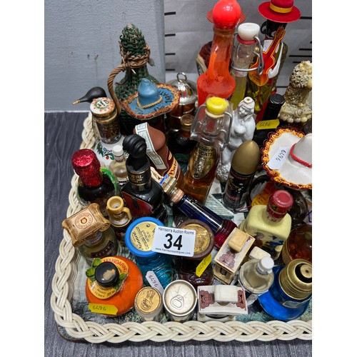 34 - Tray collectable miniture bottles mostly unopend tray not inc