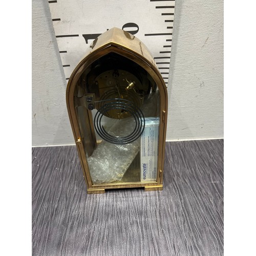 16 - Unusual Victorian Brass french arched mantle clock with bevel glass front door