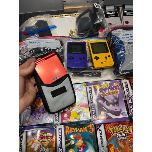 255 - Game boys x3 + case + 2 camera, games, cables, booklets