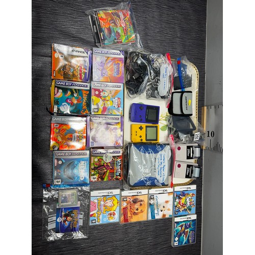 255 - Game boys x3 + case + 2 camera, games, cables, booklets