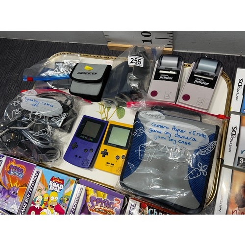 255 - Game boys x3 + case + 2 camera, games, cables, booklets