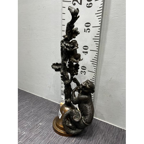 198 - Bronze monkeys climbing tree