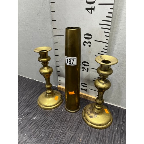 187 - Pair brass candlesticks + 1953 shell case vase