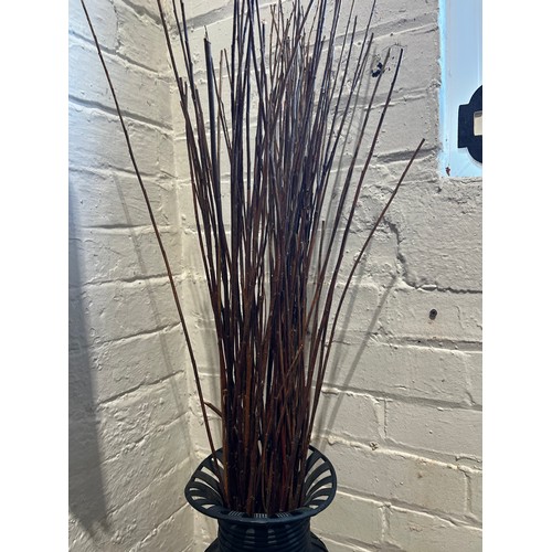 76 - Wicker & metal vase on metal stand