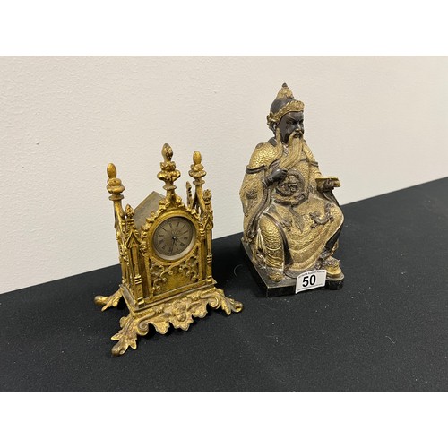 50 - Brass oriental figure and brass coloured metal clock