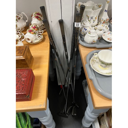 33 - 6 Golf clubs