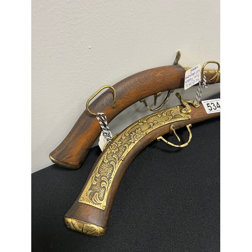 534 - 2 Oak & brass flintlock wall decoration pistols