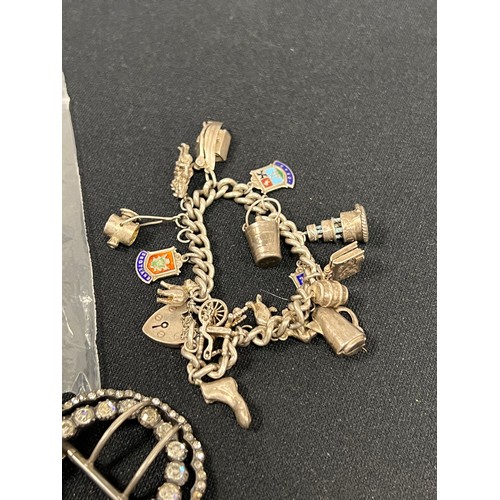 484 - Silver charm bracelet with charms + silver buckle 105.5g