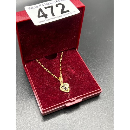 472 - 9ct Gold heart shape pendant with diamond & sapphire centre 1.4g gross on 9ct chain